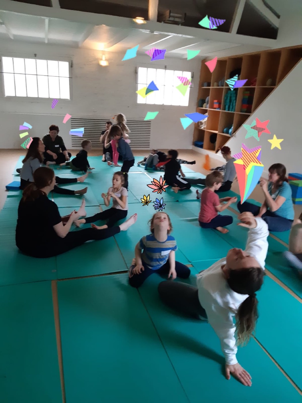 Families gathered during a movement workshop