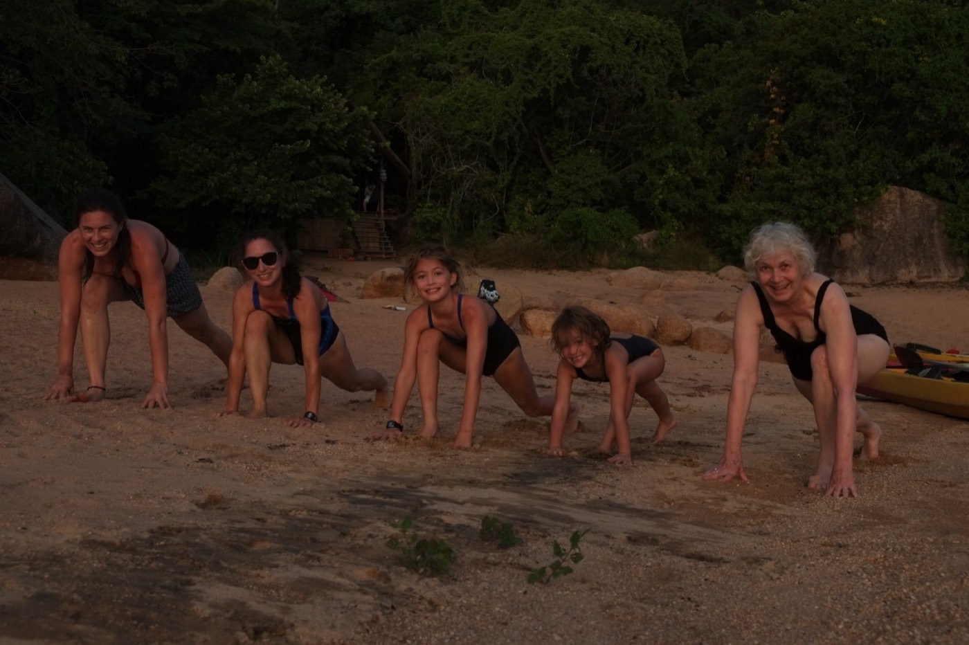 Children and adults gathered during a family yoga session