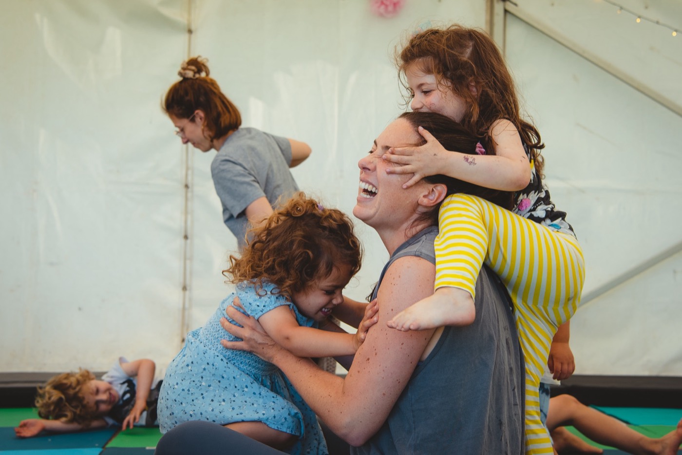 Mother and children laughing