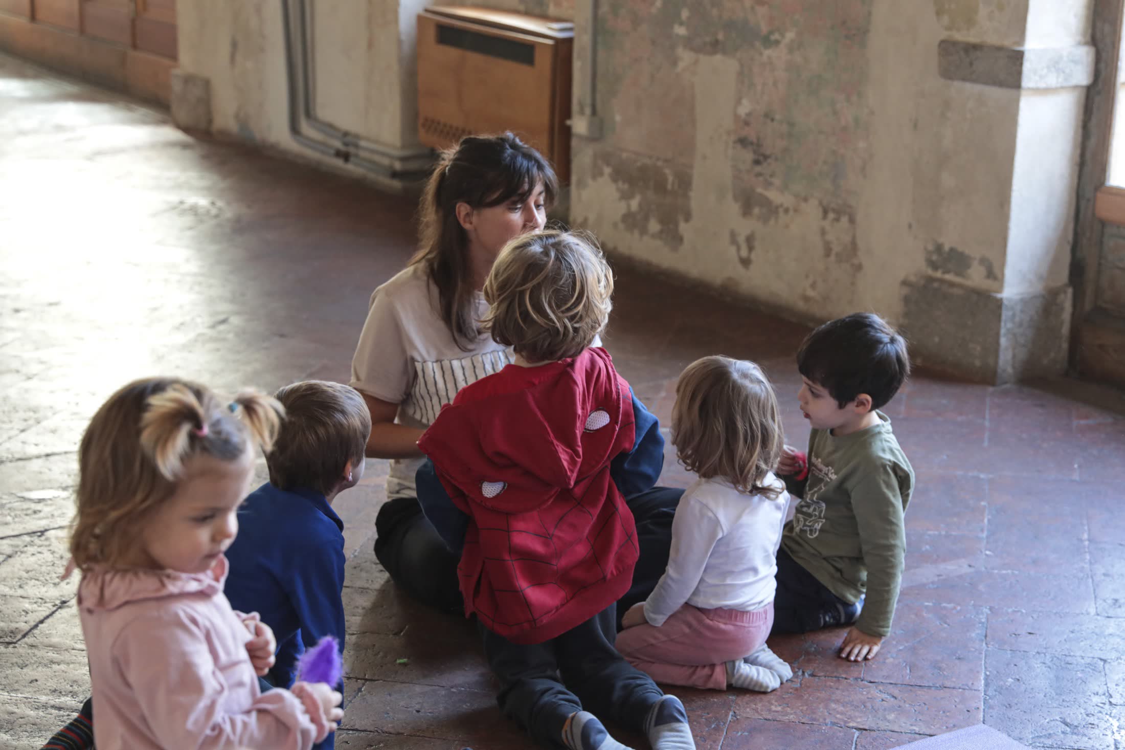 Francesca listening to children during an educational session