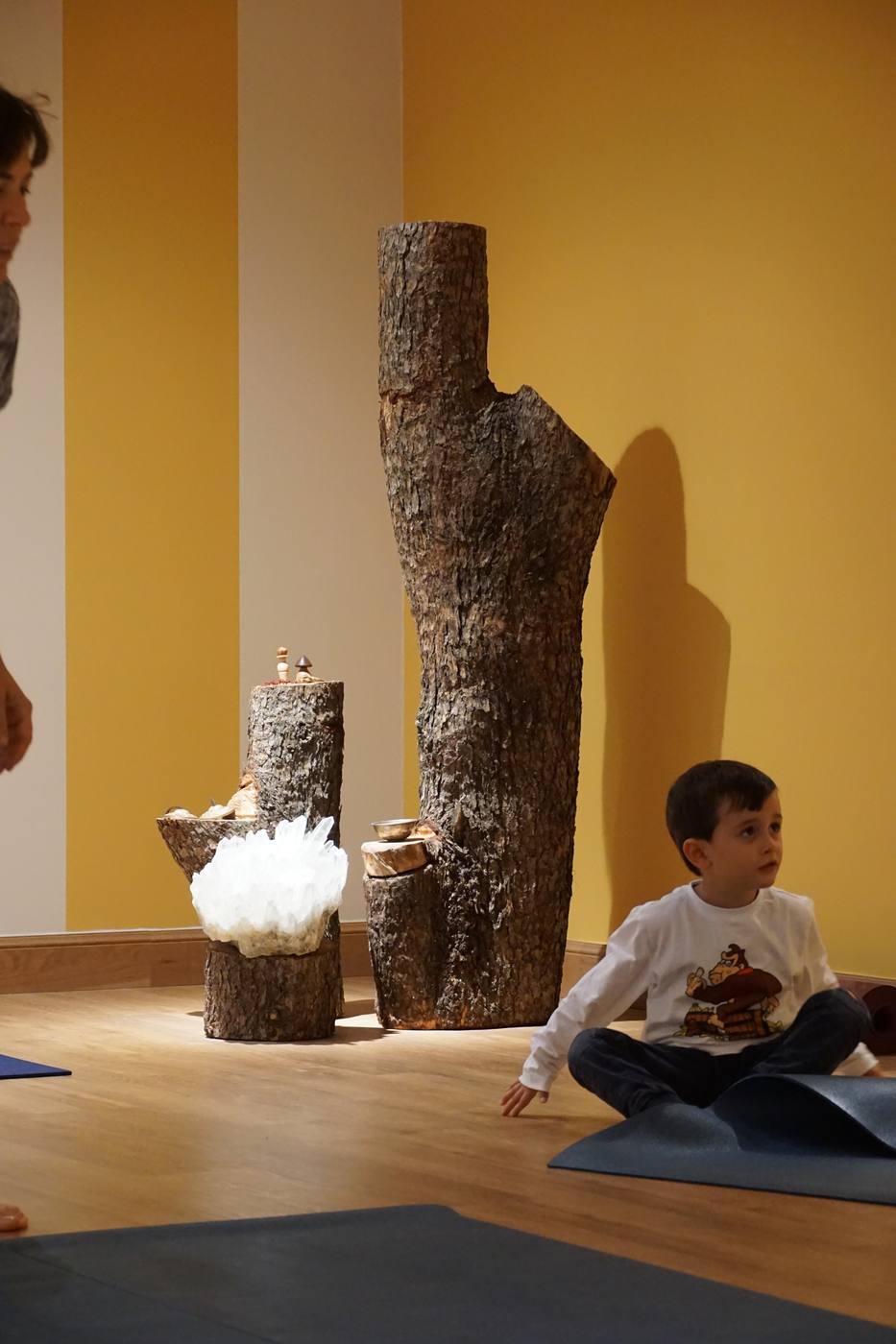 A child exploring independently while the parent watches
