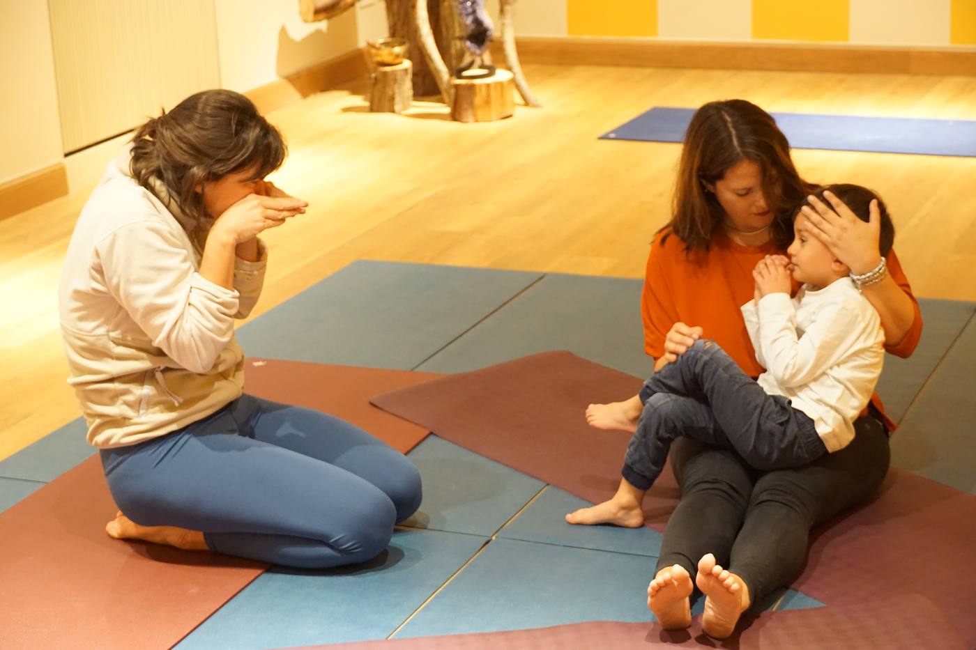 Parent, child and Francesca together in a warm moment